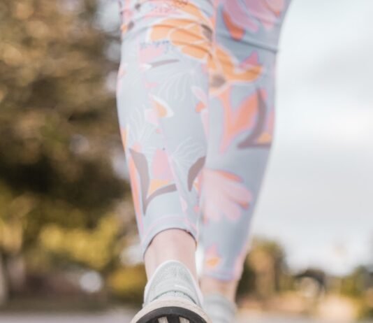 One Step at a Time: How Daily Walking Can Transform Your Body, Mind, and Life person wearing black and white nike shoes