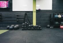 Beyond the Reps: Uncovering the Hidden Mistakes Sabotaging Your Fitness Goals a gym with kettles, kettles and exercise mats