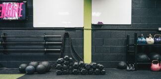 Beyond the Reps: Uncovering the Hidden Mistakes Sabotaging Your Fitness Goals a gym with kettles, kettles and exercise mats