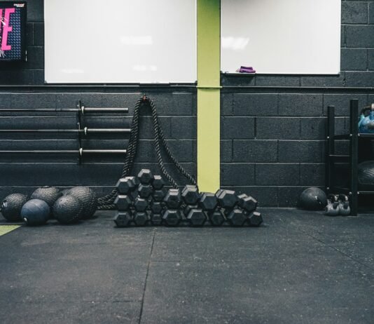 Beyond the Reps: Uncovering the Hidden Mistakes Sabotaging Your Fitness Goals a gym with kettles, kettles and exercise mats
