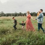 The Ties That Truly Bind: How Intentional Family Time Builds Unbreakable Bonds in a Distracted World woman holding man and toddler hands during daytime