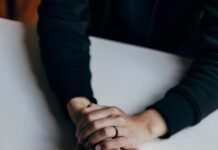 Mastering Your Inner World: Emotional Management Techniques Backed by Psychology person in black long sleeve shirt holding babys feet