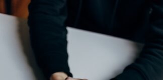 Mastering Your Inner World: Emotional Management Techniques Backed by Psychology person in black long sleeve shirt holding babys feet