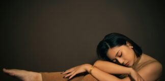 Resetting the Clock: A Real-World Guide to Fixing Your Sleep Schedule and Finding Rest That Restores a woman sitting on the ground with her arms crossed