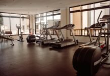 Unlocking Your Full Potential: The Power of Combining Cardio and Strength Training a gym with treadmills and exercise machines