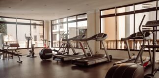 Unlocking Your Full Potential: The Power of Combining Cardio and Strength Training a gym with treadmills and exercise machines