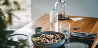 Nourish to Flourish: A Realistic Path to Eating Right and Managing Weight Naturally a wooden table topped with a bowl of food