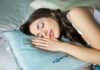Resetting Your Clock: A Real-World Guide to Overcoming Jet Lag and Reclaiming Restful Sleep woman sleeping on blue throw pillow