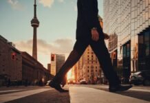 The Invisible Tug-of-War: Mastering the Balance Between Work and Rest for a Truly Healthy Life man in dress suit outfit walking in front of building