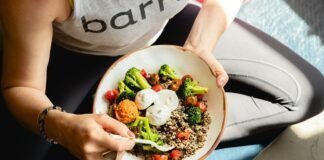 Powering Your Day: The Real-Life Guide to Getting Enough Protein, Every Single Day a woman is holding a bowl of food