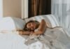 The Gentle Wind-Down: Bedtime Rituals That Actually Help You Sleep a woman lying on a bed