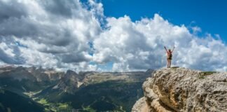 Living Well Without Obsession: 5 Anchoring Habits for a Sustainable Healthy Life woman standing on mountain