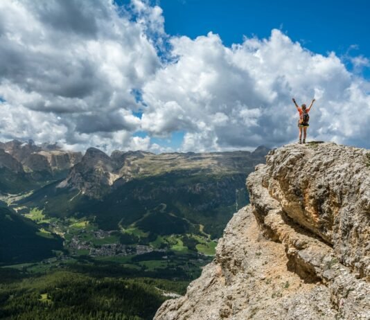 Living Well Without Obsession: 5 Anchoring Habits for a Sustainable Healthy Life woman standing on mountain